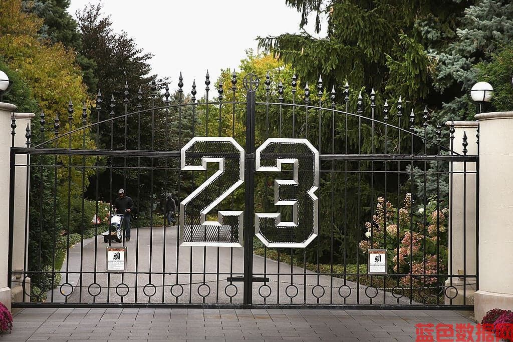 HIGHLAND PARK, IL - OCTOBER 21:  A gate with the number 23 controls access to the home of basketball legend Michael Jordan on October 21, 2013 in Highland Park, Illinois. Twenty-three is the number Jordan wore while playing basketball for the Chicago Bulls. The home which had been offered for sale for $29 million and later dropped to $21 million is scheduled to be sold at auction on November 22. The 32,683-squre-foot home features nine bedrooms, 19 bathrooms, a 15-car attached garage and an "NBA-quality" basketball court.  (Photo by Scott Olson/Getty Images)